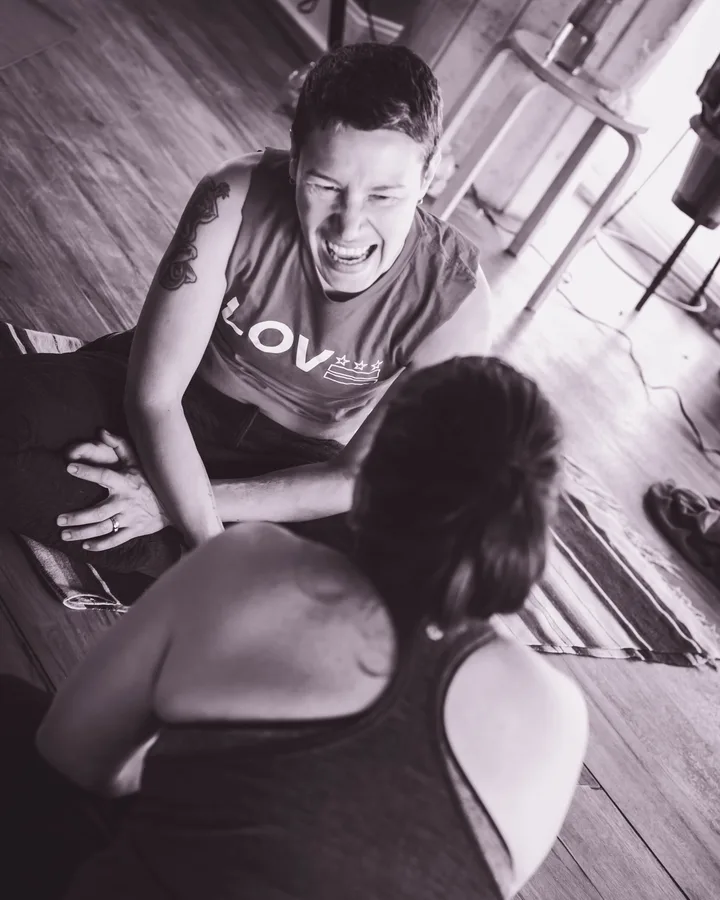 Erin laughing, unmasked and joyful
